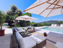 sky, umbrella, palm tree, table, chair, swimming pool, coffee table, outdoor, shade, tent, sunlounger, hotel, beach